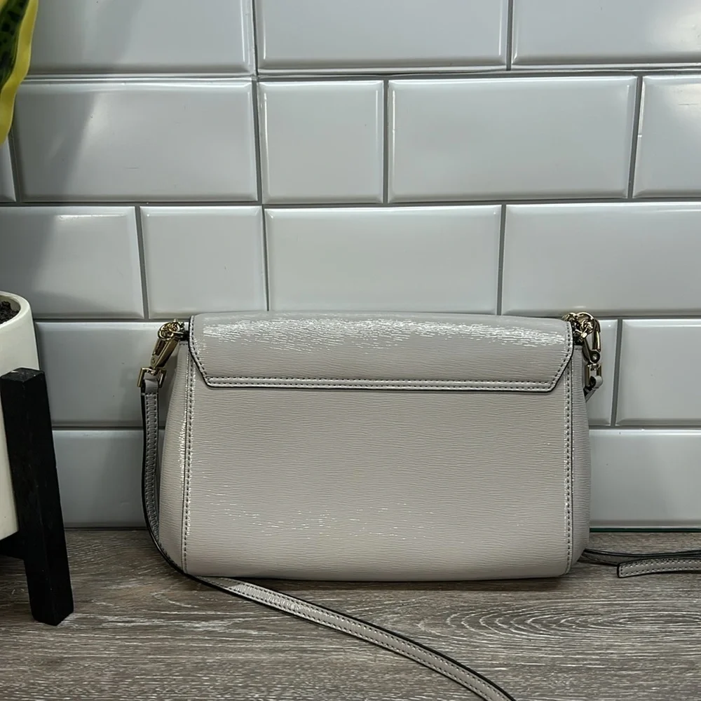 Kate Spade gray crossbody with gold chain
